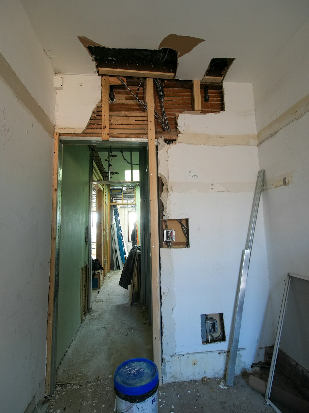 Room mid-renovation with exposed framing