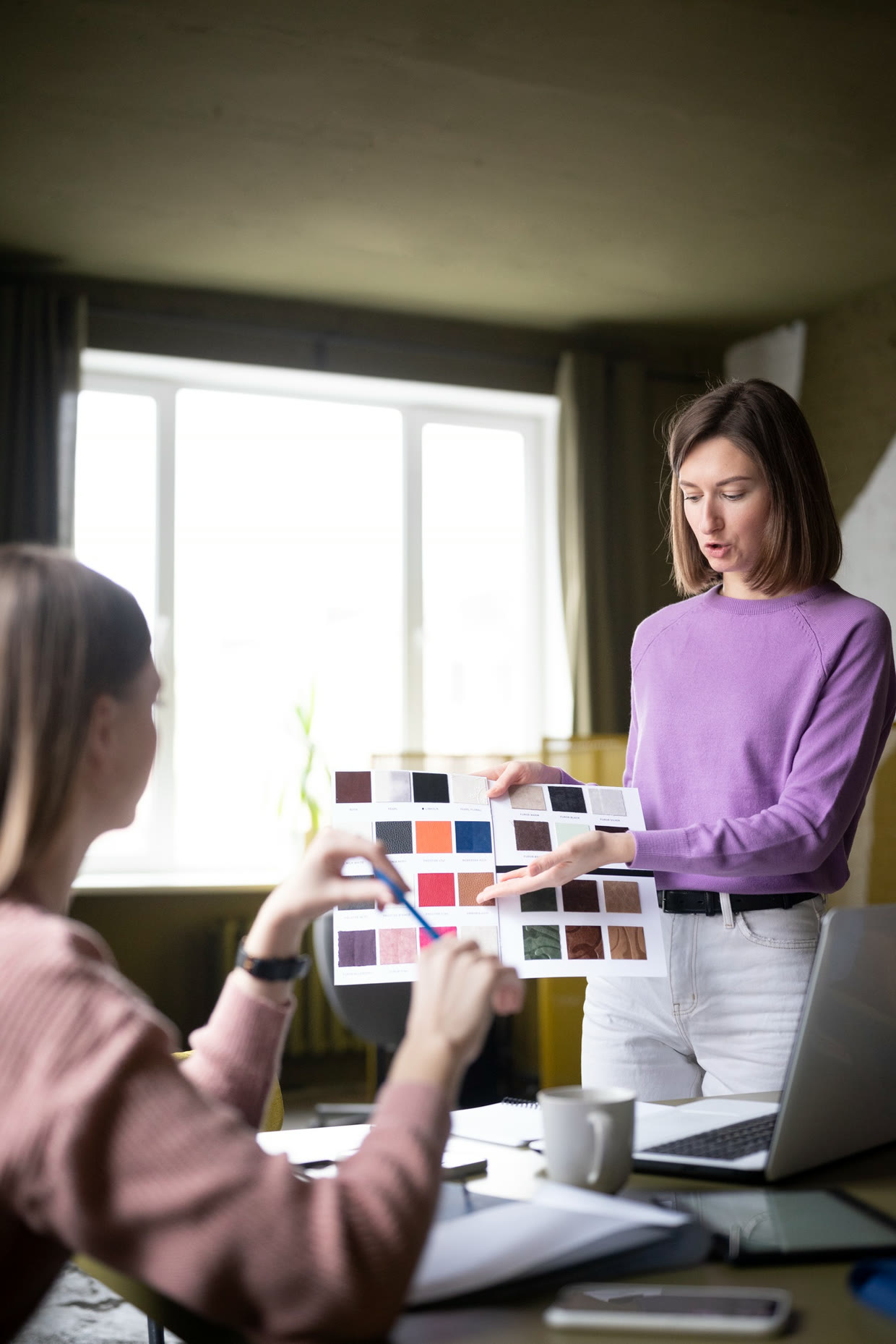Consultant showing colour samples to a homeowner