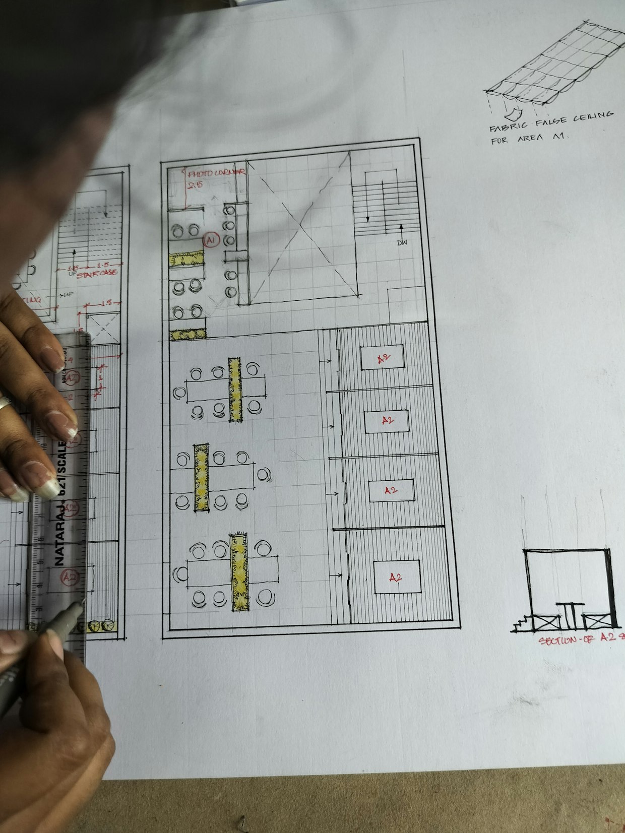 Designer drawing a floor plan by hand