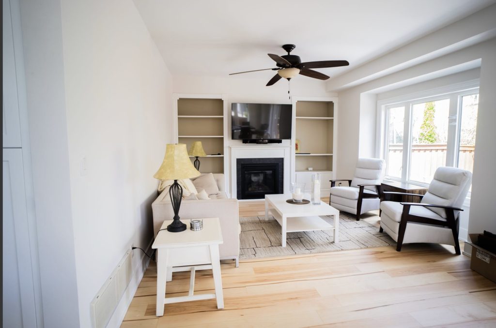 Family room with built-in shelving and a fireplace