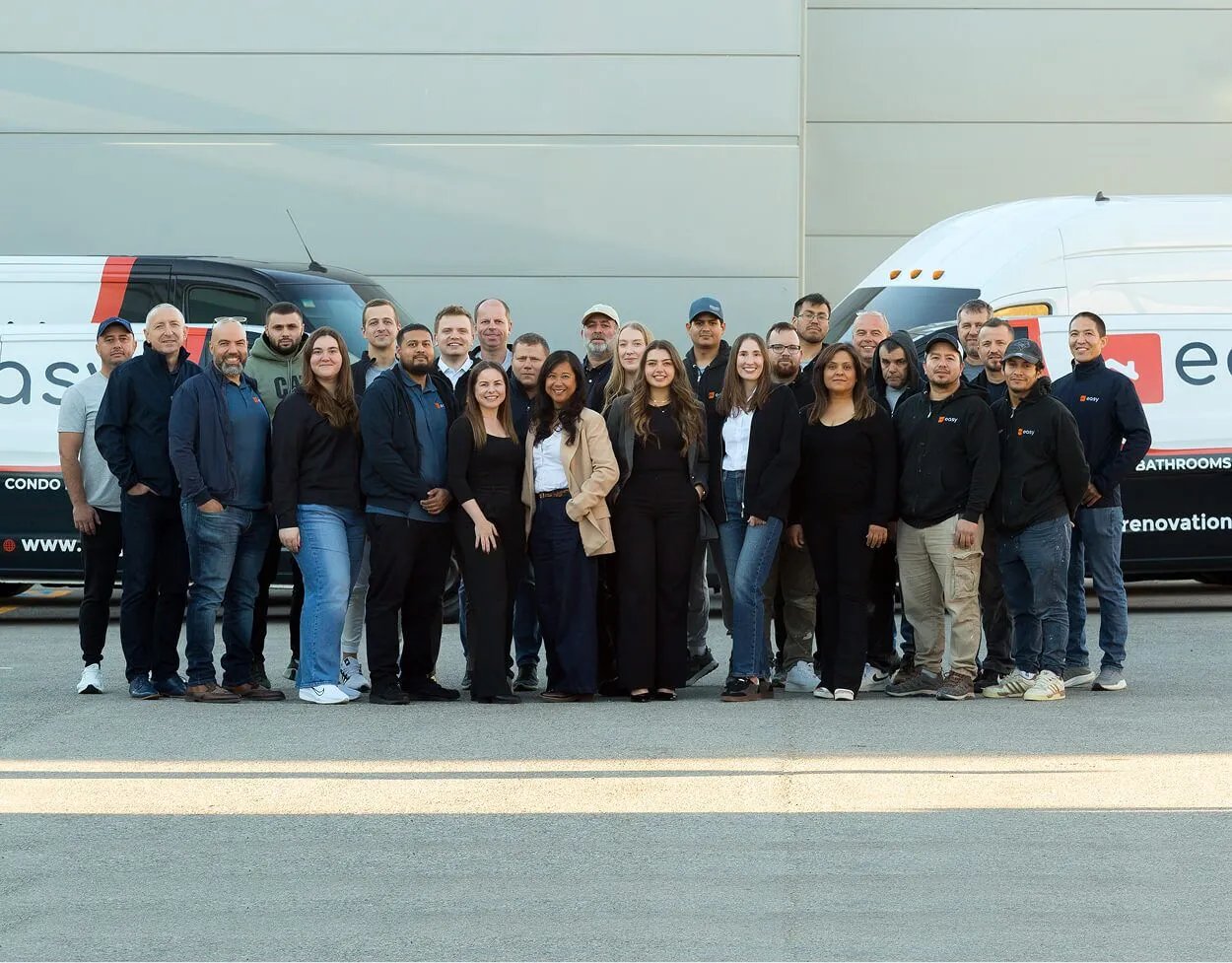 The Easy Renovation team in front of the company vans